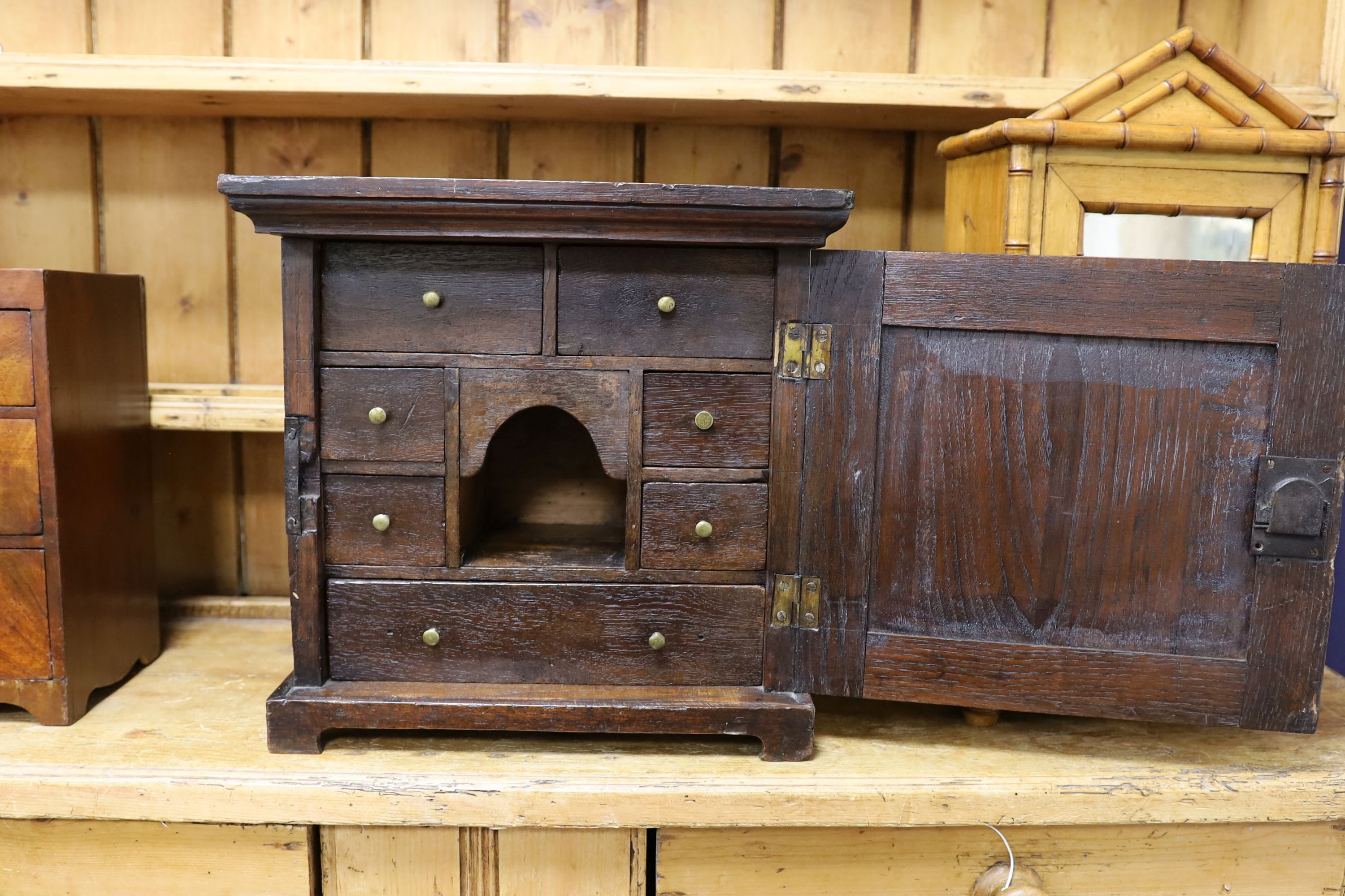 An 18th century oak spice cabinet, width 40cm, depth 22cm, height 38cm